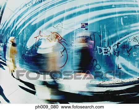Pedestrians walking along pathway View Large Photo Image Stock Image - Pedestrians walking along pathway. Fotosearch