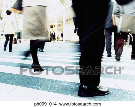 Picture - People crossing city street (blurred motion). Fotosearch