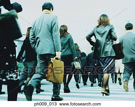 Stock Image - People crossing city street, Shibuya, Tokyo, Japan. Fotosearch