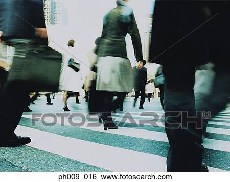 Stock Photograph - People crossing city street, Shibuya, Tokyo, Japan (blurred motion). Fotosearch