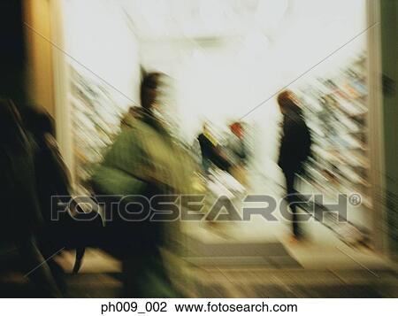 Stock Image - Shopping crowd (blurred motion) . Fotosearch