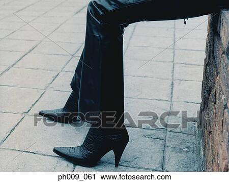 Woman sitting alone pavement View Large Photo Image Stock Image - Woman sitting alone pavement. Fotosearch