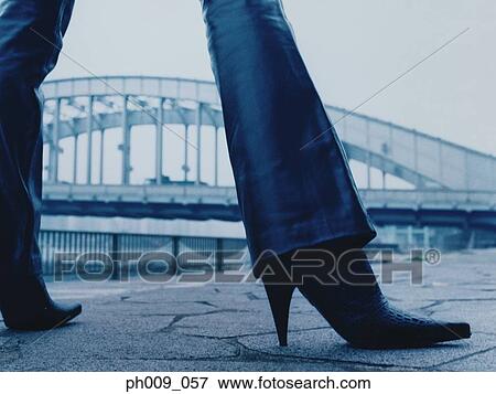Stock Photo - Woman walking on pavement, Kachidoki Bridge, Tokyo, Japan. Fotosearch
