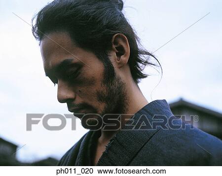 Close up of a Samurai warrior looking down View Large Photo Image Stock Image - Close up of a Samurai warrior looking down. Fotosearch