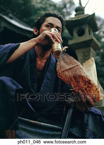 Samurai warrior drinking water View Large Photo Image Stock Photograph - Samurai warrior drinking water. Fotosearch