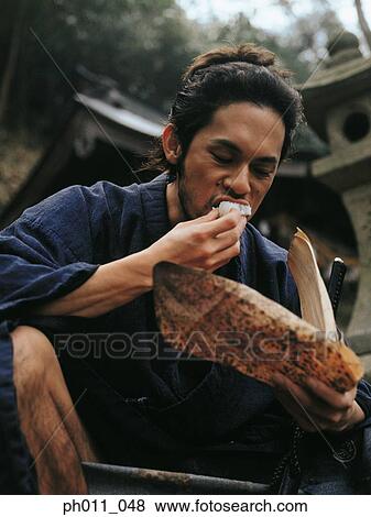 Samurai warrior eating food View Large Photo Image Stock Photo - Samurai warrior eating food. Fotosearch
