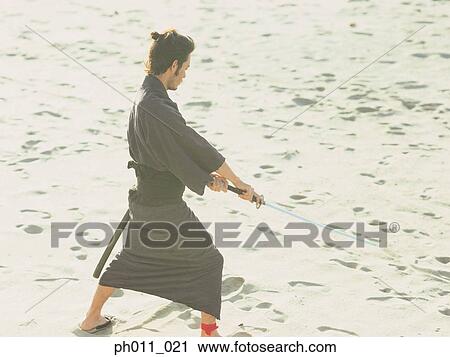 Samurai warrior practicing martial art View Large Photo Image Stock Image - Samurai warrior practicing martial art. Fotosearch