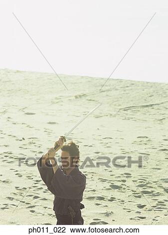 Samurai warrior practicing martial art View Large Photo Image Stock Image - Samurai warrior practicing martial art. Fotosearch