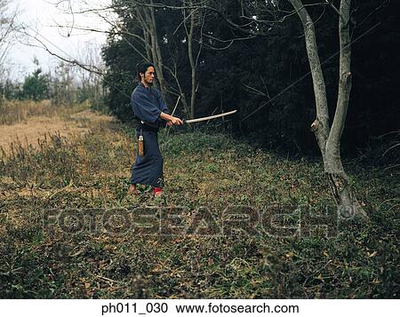 Samurai warrior practicing martial art View Large Photo Image Stock Image - Samurai warrior practicing martial art. Fotosearch