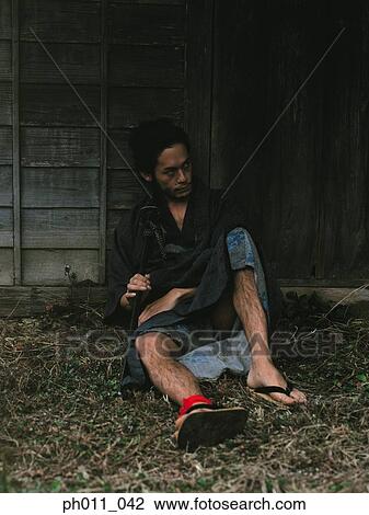 Samurai warrior sitting against a house View Large Photo Image Stock Image - Samurai warrior sitting against a house. Fotosearch