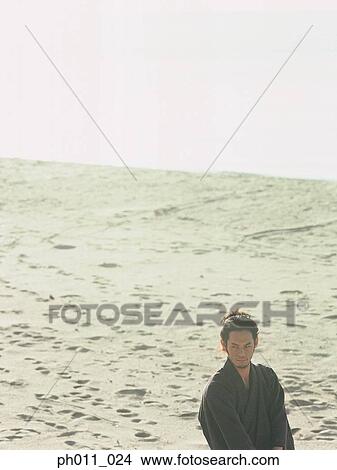 Samurai warrior standing at the beach View Large Photo Image Picture - Samurai warrior standing at the beach. Fotosearch