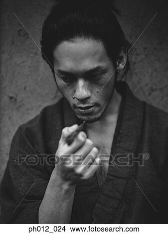 Picture - Portrait of a Japanese man in traditional costume. Fotosearch