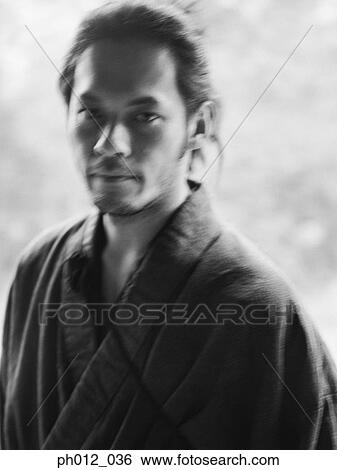 Stock Photograph - Portrait of a Japanese man in traditional costume. Fotosearch