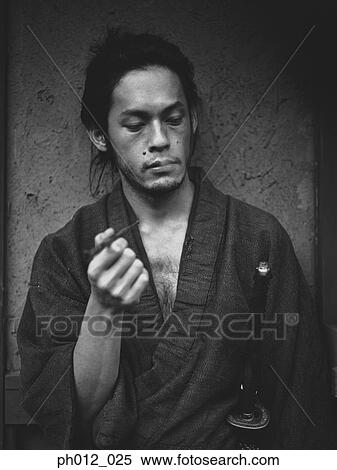Stock Photography - Portrait of a Japanese man in traditional costume. Fotosearch
