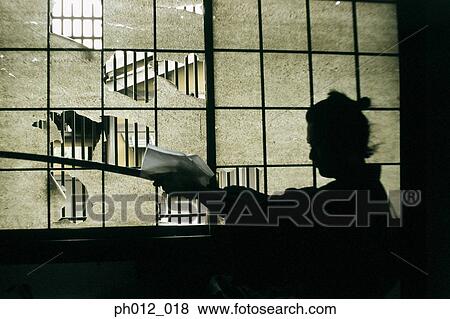 Stock Photo - Samurai warrior cleaning a sword. Fotosearch