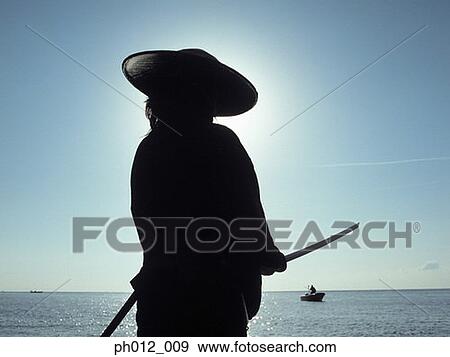 Samurai warrior holding a sword View Large Photo Image Stock Photo - Samurai warrior holding a sword. Fotosearch