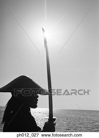 Stock Photo - Samurai warrior holding a sword. Fotosearch
