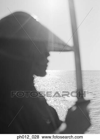 Samurai warrior holding a sword View Large Photo Image Stock Photo - Samurai warrior holding a sword. Fotosearch