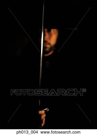 Portrait of a Samurai warrior holding a sword View Large Photo Image Picture - Portrait of a Samurai warrior holding a sword. Fotosearch