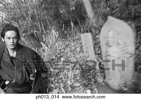 Samurai warrior running in an isolated land View Large Photo Image Picture - Samurai warrior running in an isolated land. Fotosearch