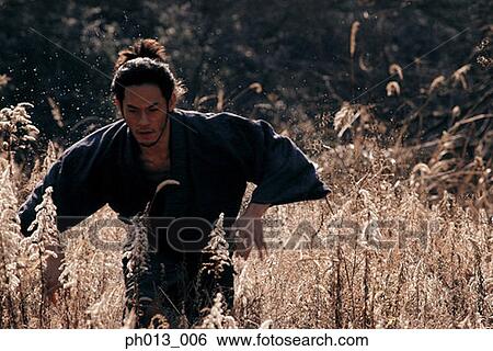 Samurai warrior running in an isolated land View Large Photo Image Stock Photograph - Samurai warrior running in an isolated land. Fotosearch
