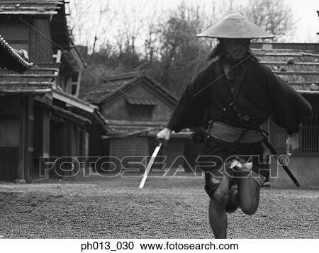Samurai warrior running with a sword in his hand View Large Photo Image Stock Image - Samurai warrior running with a sword in his hand. Fotosearch