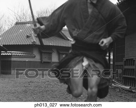 Stock Photo - Samurai warrior running with a sword in his hand. Fotosearch