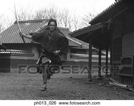 Samurai warrior running with a sword in his hand View Large Photo Image Stock Photograph - Samurai warrior running with a sword in his hand. Fotosearch