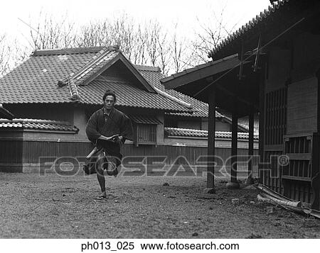 Stock Photography - Samurai warrior running with a sword in his hand. Fotosearch