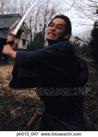 Samurai warrior striking an attack View Large Photo Image Stock Photo - Samurai warrior striking an attack. Fotosearch