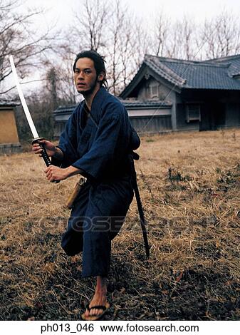Samurai warrior striking an attack View Large Photo Image Stock Photograph - Samurai warrior striking an attack. Fotosearch