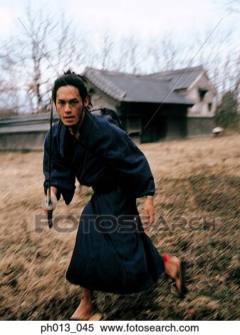 Samurai warrior striking an attack View Large Photo Image Stock Photography - Samurai warrior striking an attack. Fotosearch