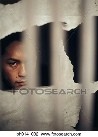 Stock Image - Portrait of a Japanese man in a room. Fotosearch