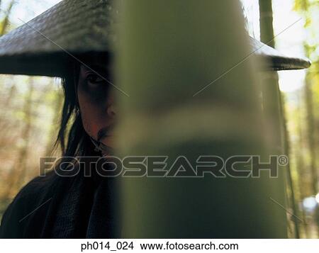 Picture - Portrait of a Japanese man in cone hat. Fotosearch