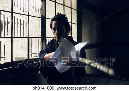 Samurai warrior cleaning a sword View Large Photo Image Stock Photograph - Samurai warrior cleaning a sword. Fotosearch