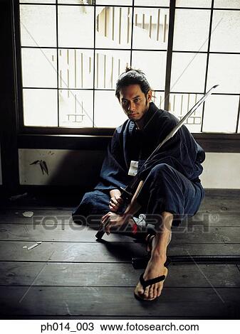 Samurai warrior holding a sword Stock Image | ph014_003 | Fotosearch