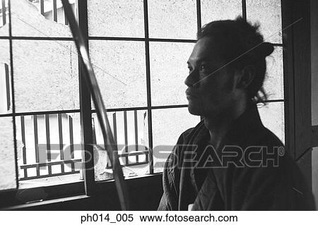 Stock Photography - Samurai warrior holding a sword. Fotosearch