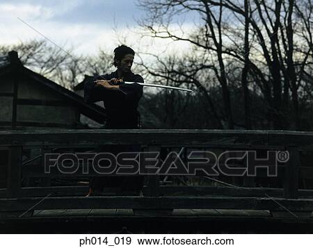Samurai warrior practicing sword play View Large Photo Image Stock Photo - Samurai warrior practicing sword play. Fotosearch