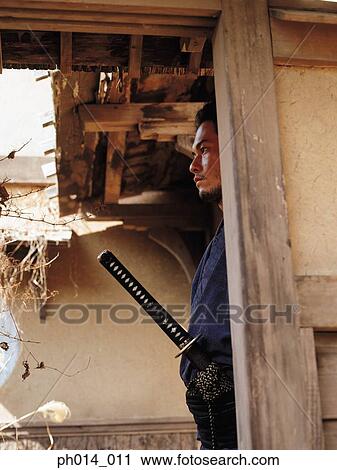 Samurai warrior standing in a room View Large Photo Image Stock Image - Samurai warrior standing in a room. Fotosearch