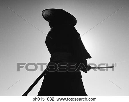 Portrait of a Samurai warrior holding a sword View Large Photo Image Stock Image - Portrait of a Samurai warrior holding a sword. Fotosearch