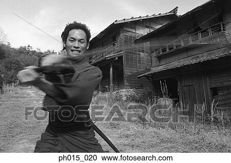 Samurai warrior attacks with a sword View Large Photo Image Stock Image - Samurai warrior attacks with a sword. Fotosearch
