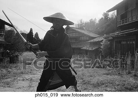 Samurai warrior attacks with a sword View Large Photo Image Stock Photo - Samurai warrior attacks with a sword. Fotosearch