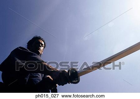 Samurai warrior attacks with a sword View Large Photo Image Stock Photo - Samurai warrior attacks with a sword. Fotosearch