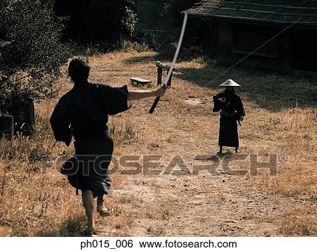 Samurai warrior attacks with a sword View Large Photo Image Stock Photograph - Samurai warrior attacks with a sword. Fotosearch