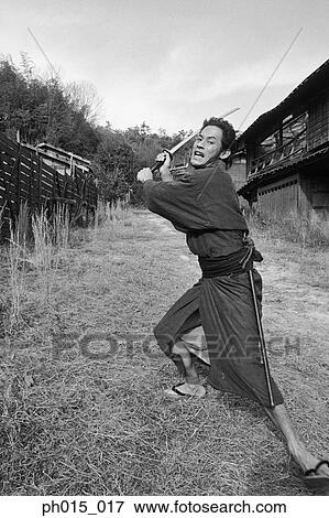 Stock Photo - Samurai warrior strikes an attack. Fotosearch