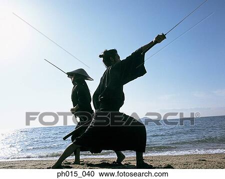 Stock Image - Two Samurai warriors fighting. Fotosearch