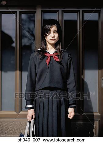 Stock Photo - School girl in front of the window. Fotosearch