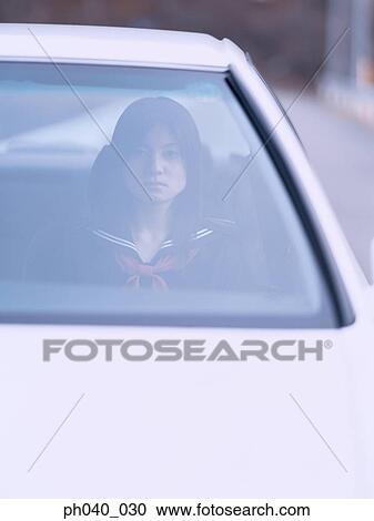School girl sitting in a car View Large Photo Image Stock Image - School girl sitting in a car. Fotosearch