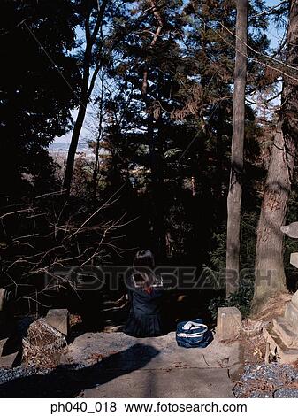 School girl sitting on the rock steps View Large Photo Image Stock Photo - School girl sitting on the rock steps. Fotosearch