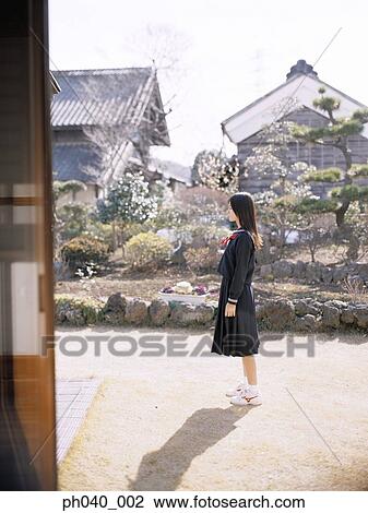 School girl standing in the front yard View Large Photo Image Stock Image - School girl standing in the front yard. Fotosearch